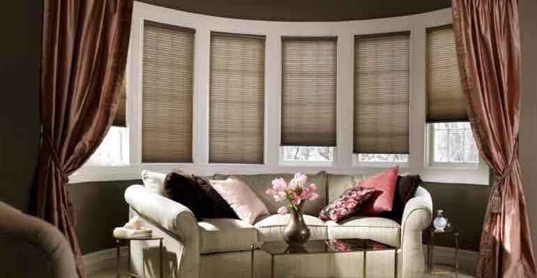 Brown cellular shades in parlour bow window.